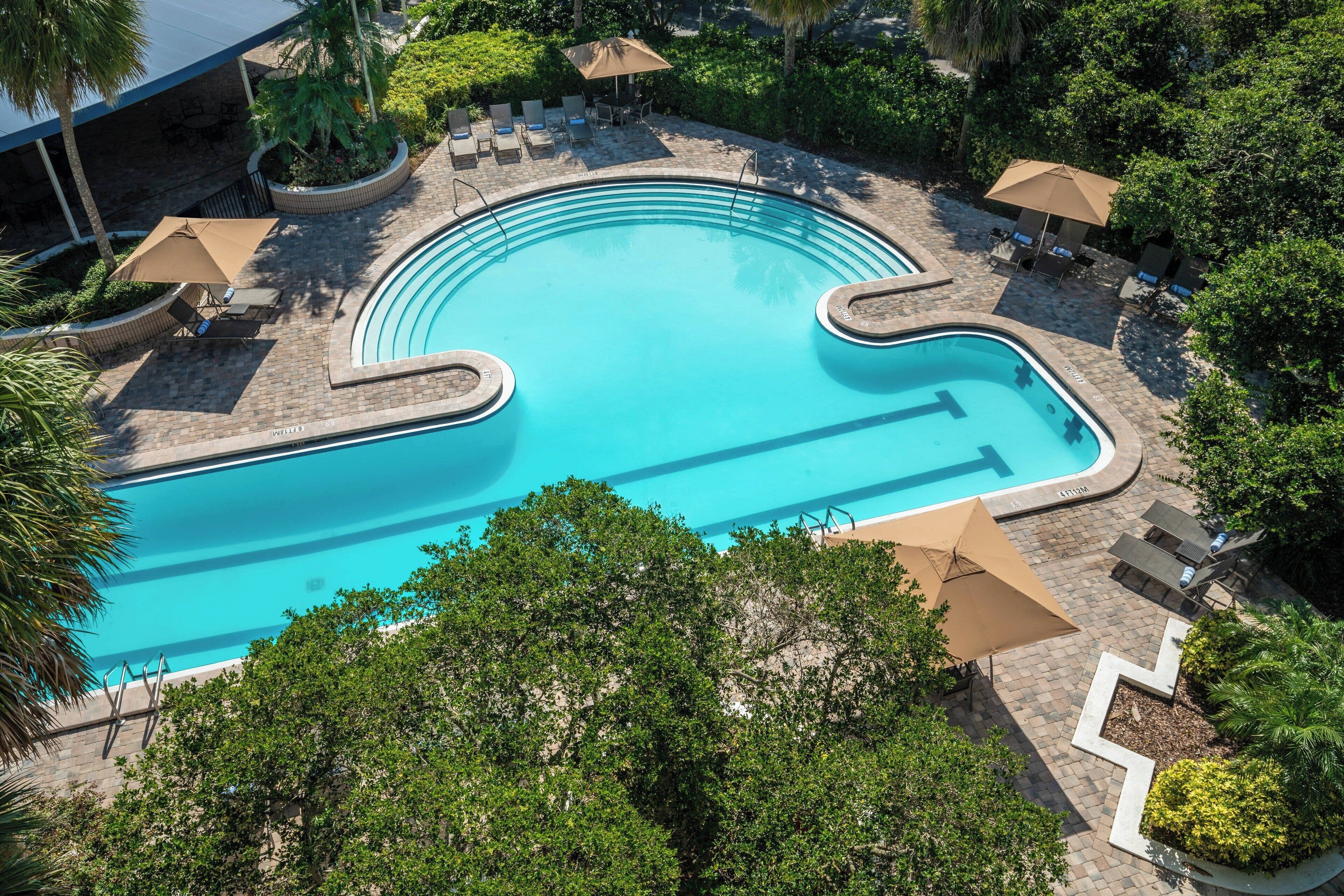 Outdoor pool, open 9:00 AM to 6:00 PM, pool umbrellas