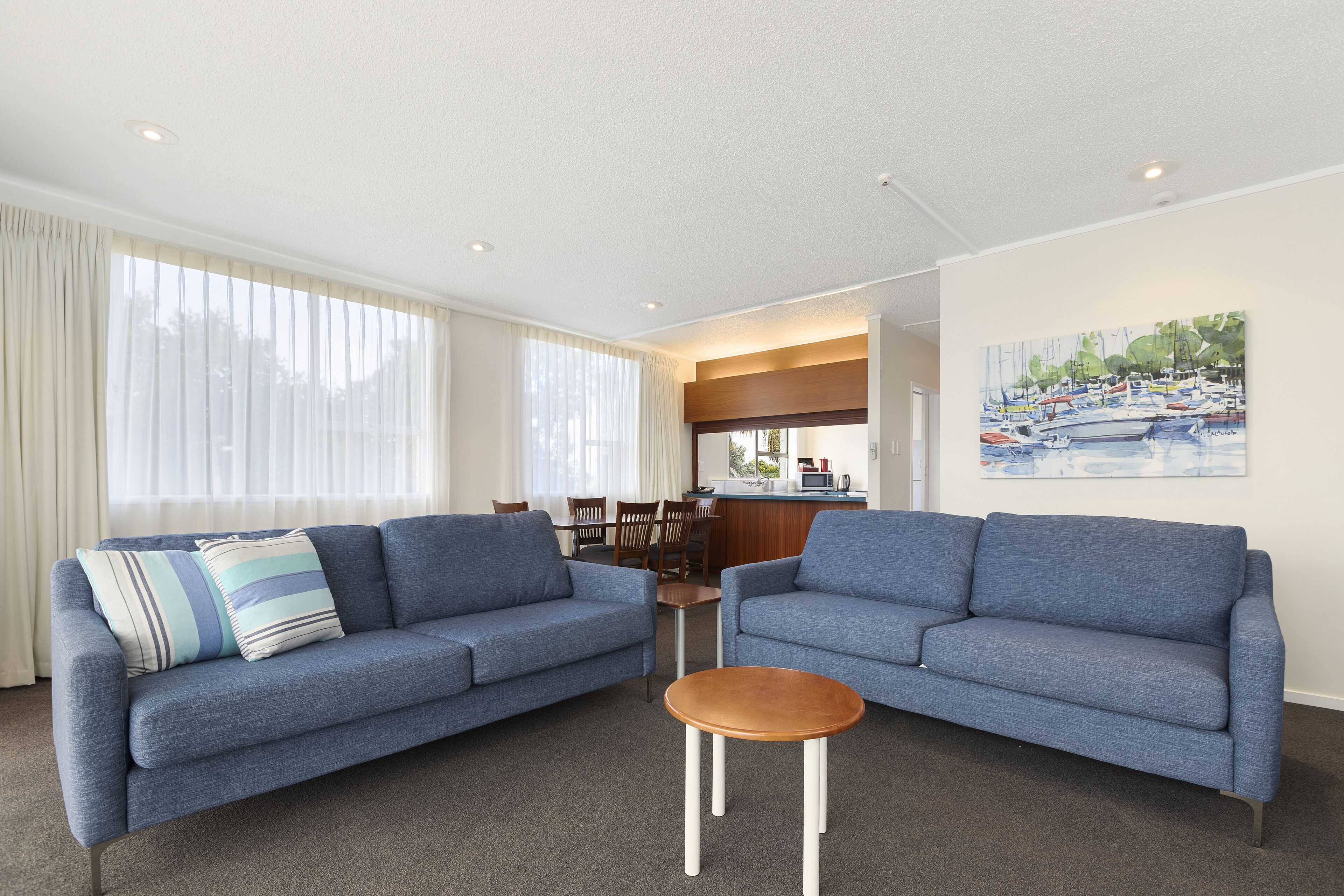 two bedroom standard apartment with balcony | living area | 42-inch smart tv with satellite channels