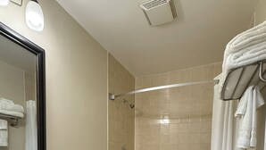 A bathroom with a sink, toilet, and bathtub.