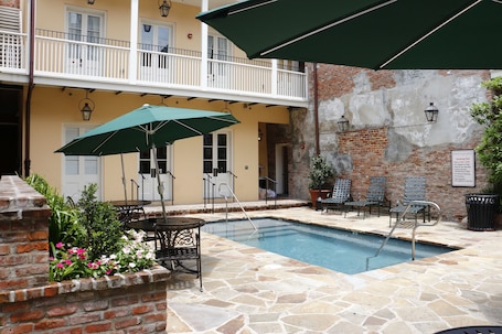 Outdoor pool, sun loungers. French Market Inn