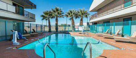 Seasonal outdoor pool, pool loungers