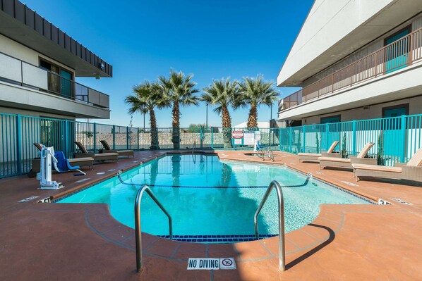 Seasonal outdoor pool, pool loungers