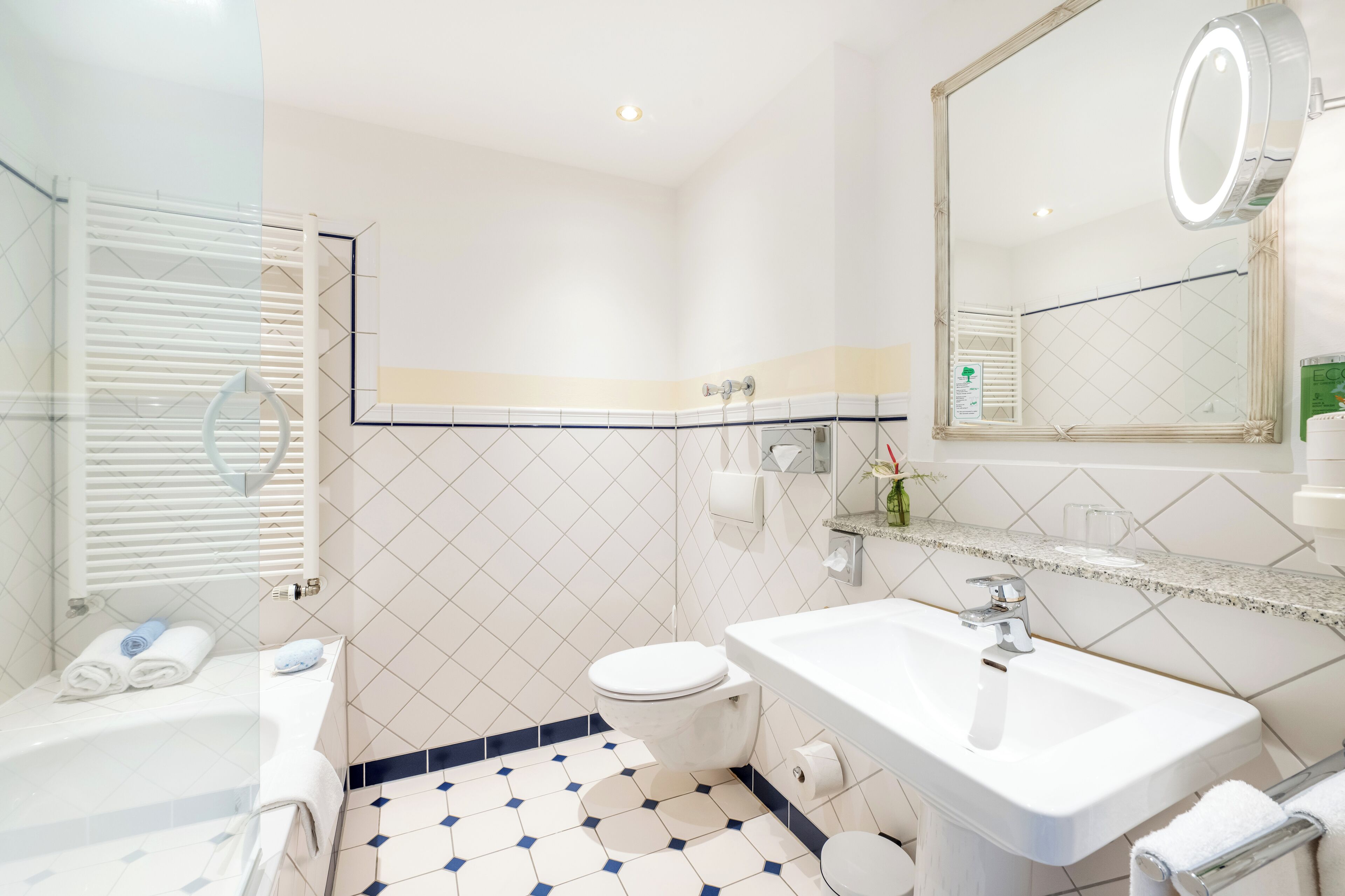 separate bathtub and shower, hair dryer, towels