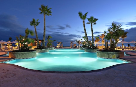2 outdoor pools, open 7:00 AM to 10:00 PM, pool umbrellas, sun loungers. Hilton Ponce Golf & Casino Resort