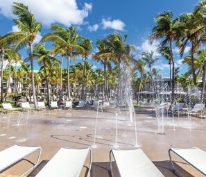 2 outdoor pools, open 7:00 AM to 10:00 PM, pool umbrellas, pool loungers