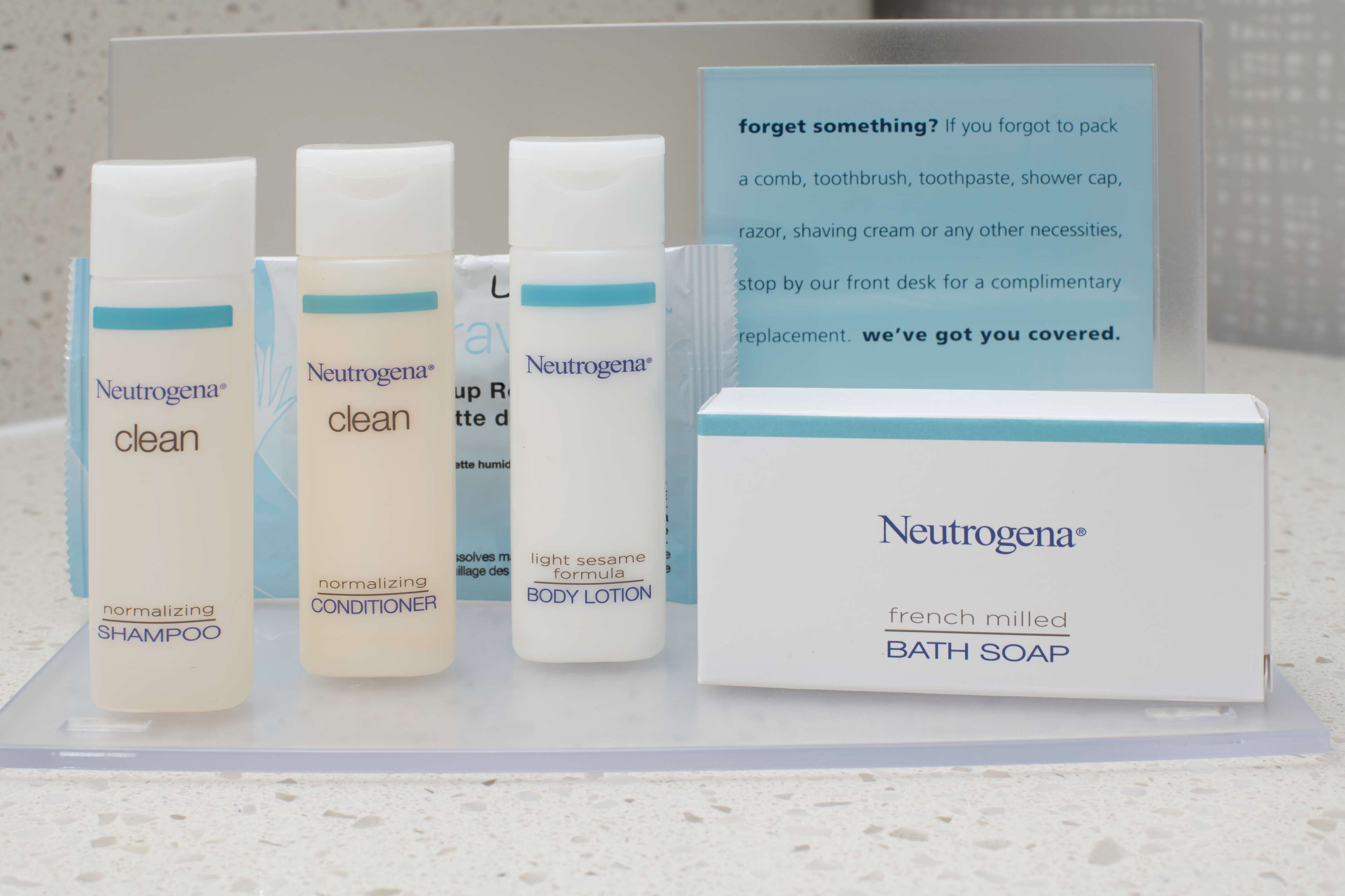 A display of Neutrogena products including shampoo, conditioner, body lotion, and bath soap.