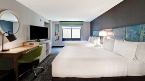 A hotel room with a bed, a desk with a chair, a television, a mirror, and a window with a view. - Hampton Inn Egg Harbor Township Atlantic City (Egg Harbor Township)