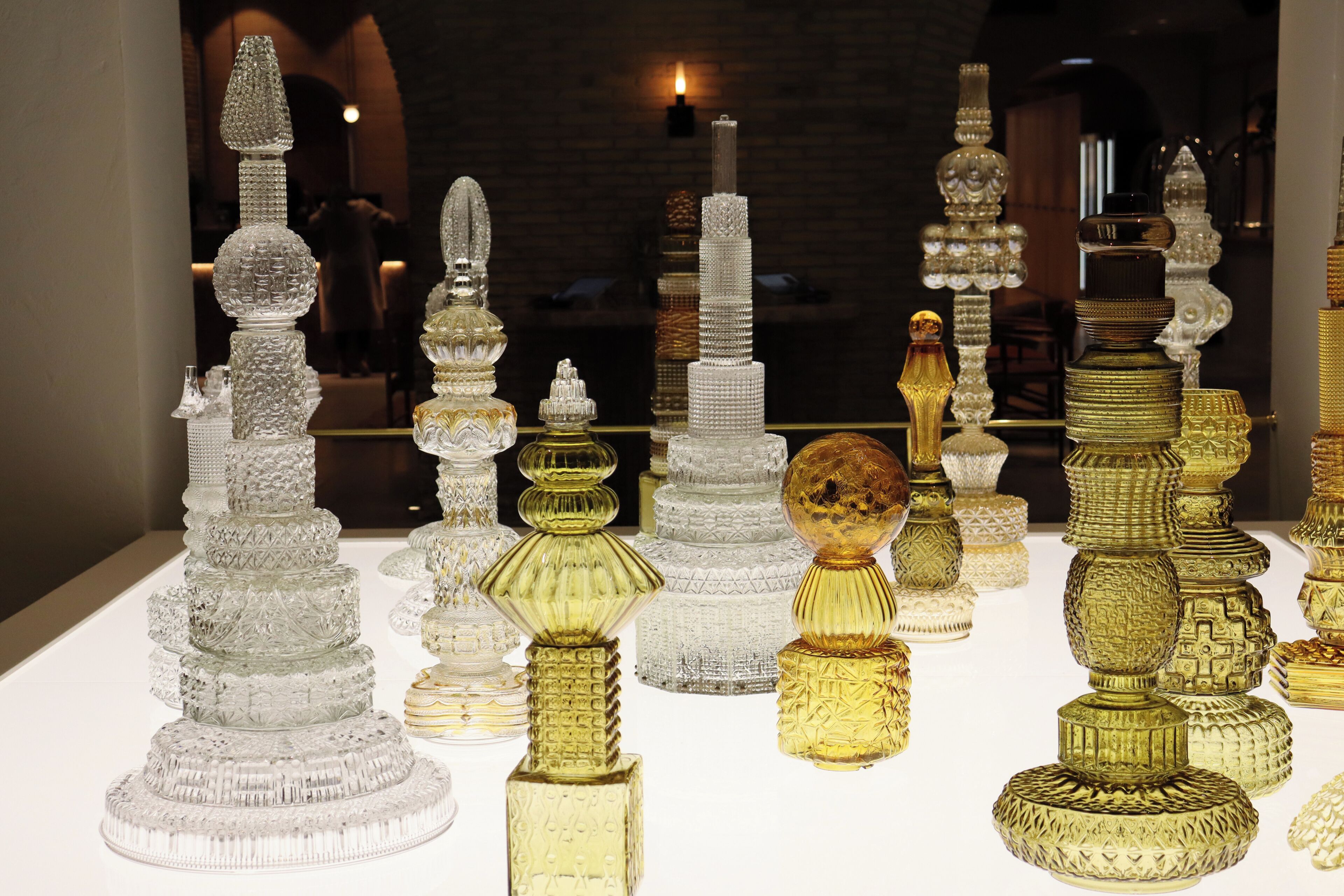 A collection of intricately designed glass objects on display.