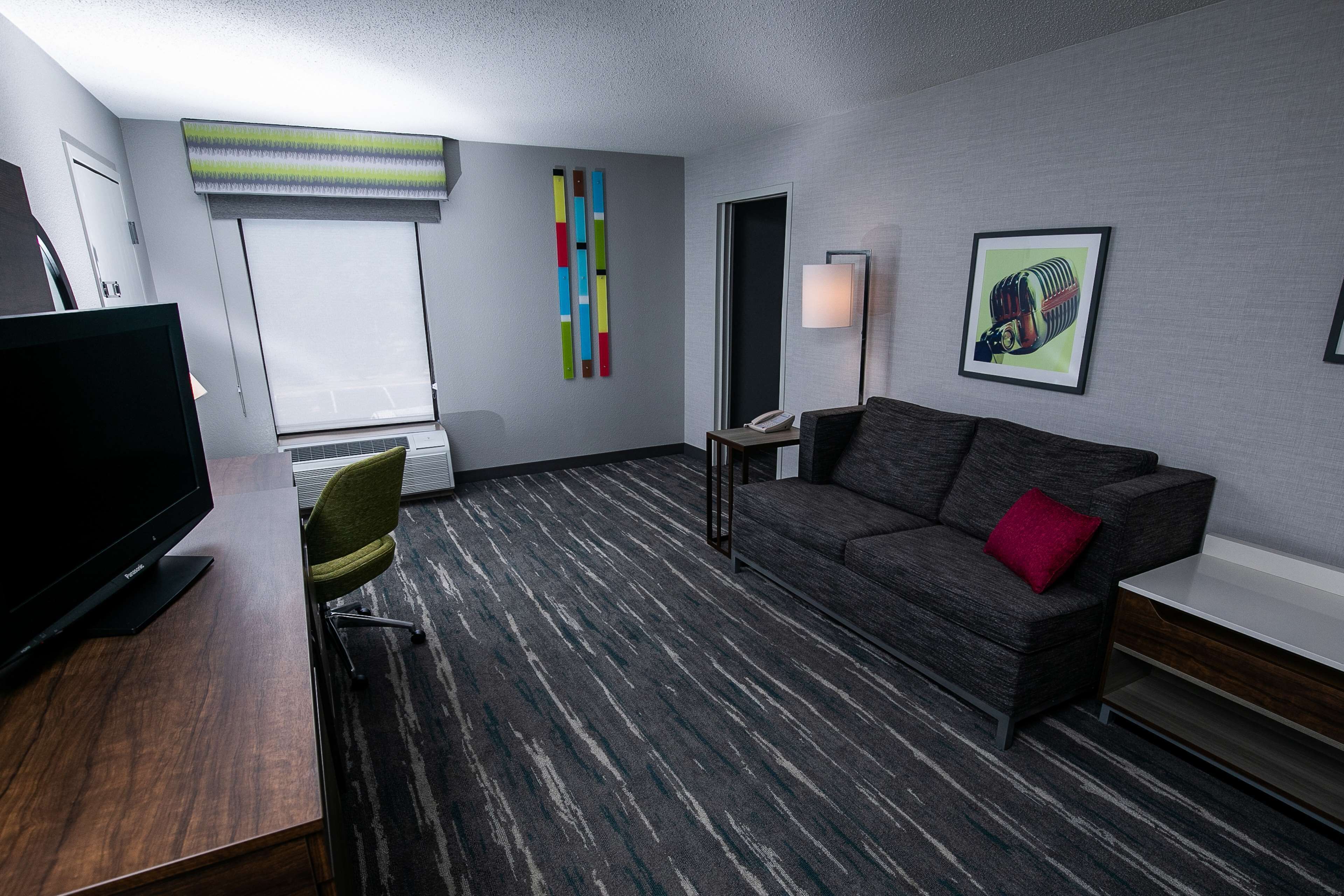 Suite, 1 King Bed, Non Smoking | Living area | 50-inch TV with satellite channels