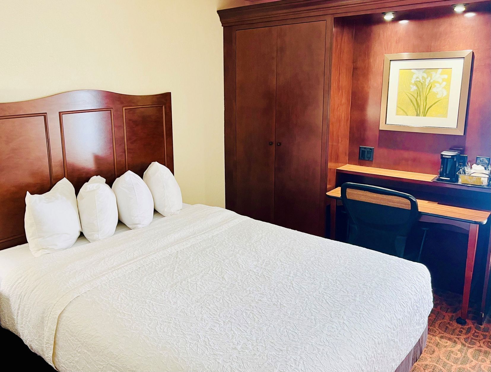 Desk, laptop workspace, iron/ironing board, free cribs/infant beds