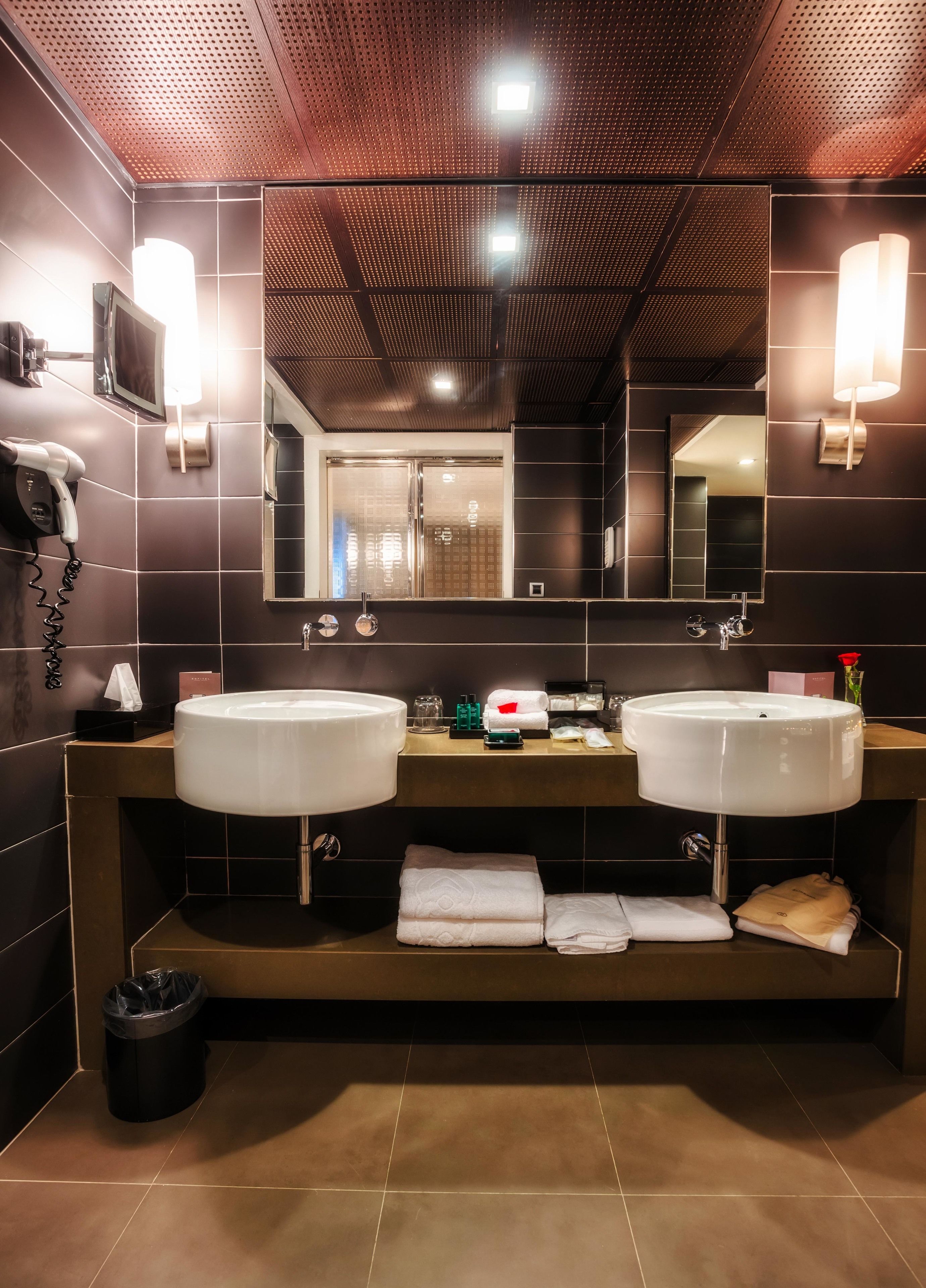 designer toiletries, hair dryer, bathrobes, slippers