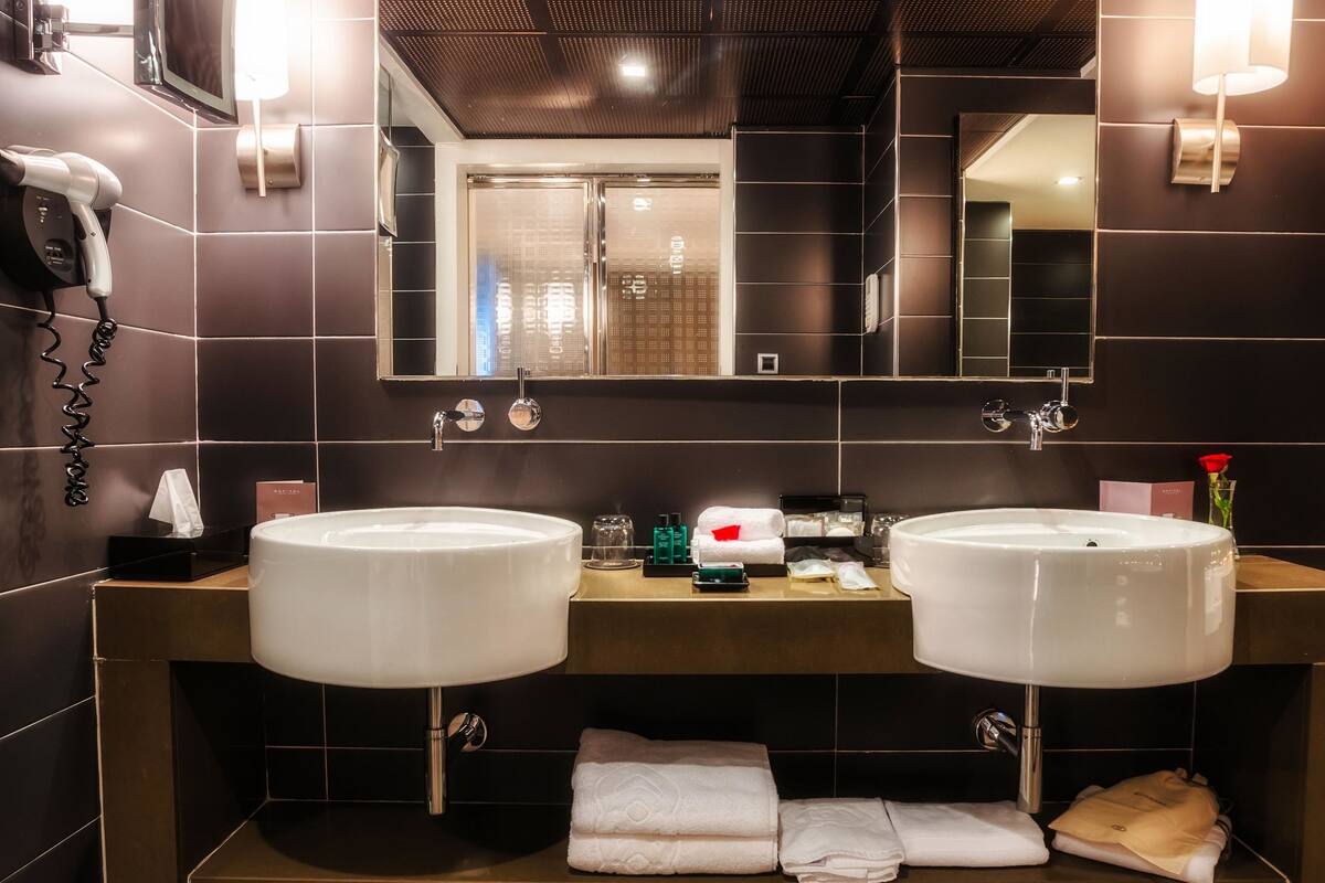 designer toiletries, hair dryer, bathrobes, slippers