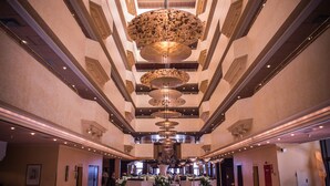 A spacious atrium with a high ceiling, multiple floors, and a central decorative element. - Sofitel Algiers Hamma Garden (Algiers)