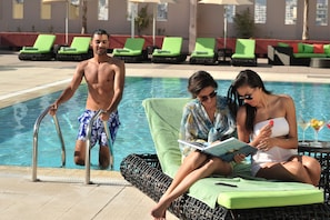 Indoor pool, outdoor pool, pool umbrellas, pool loungers