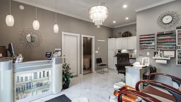 Relax in style with comfortable seating, a massage chair, and a footrest.
