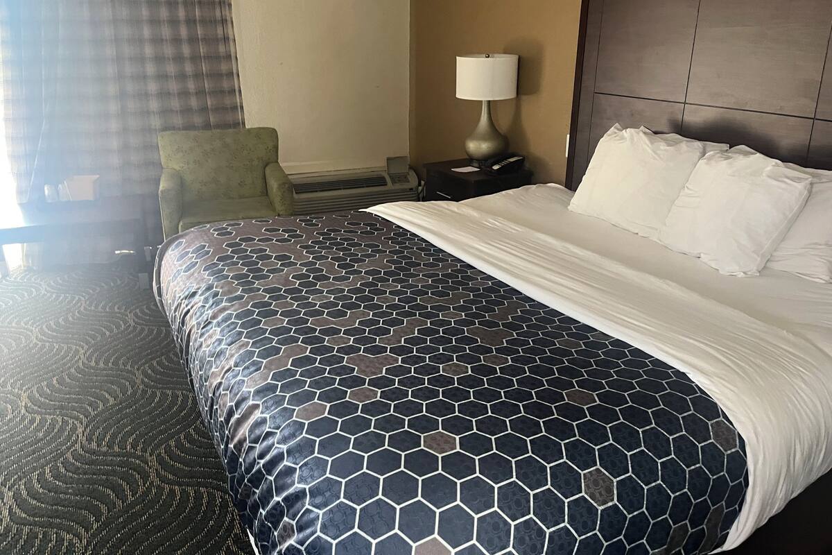 Down comforters, desk, blackout drapes, iron/ironing board