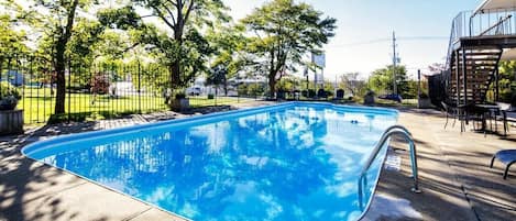 Seasonal outdoor pool, pool loungers