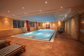 Relax by the pool, where a diving board invites you to take the plunge.