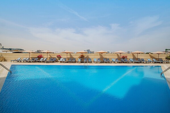 2 outdoor pools, open 8:00 AM to 9:00 PM, pool umbrellas, pool loungers