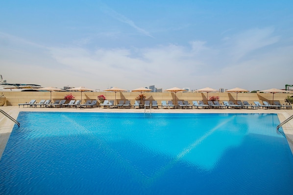 2 outdoor pools, open 8:00 AM to 9:00 PM, pool umbrellas, pool loungers