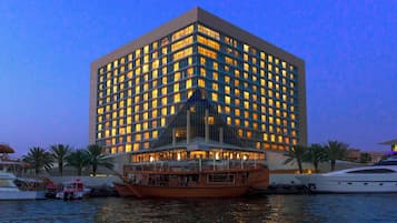 Overlooking the waterfront, this hotel features a striking central atrium and a boat dock at its edge.