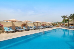 2 outdoor pools, open 8:00 AM to 8:00 PM, pool umbrellas, pool loungers