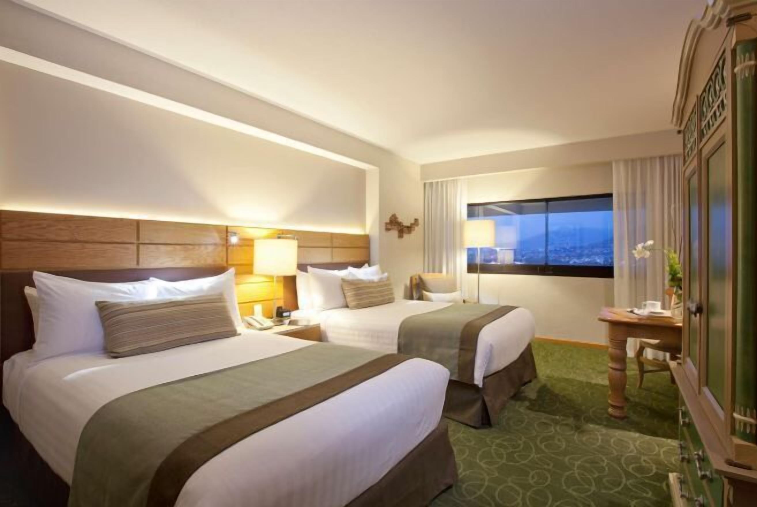 Premium bedding, down comforters, in-room safe, desk