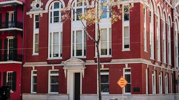 A red brick building with white trim and large windows.