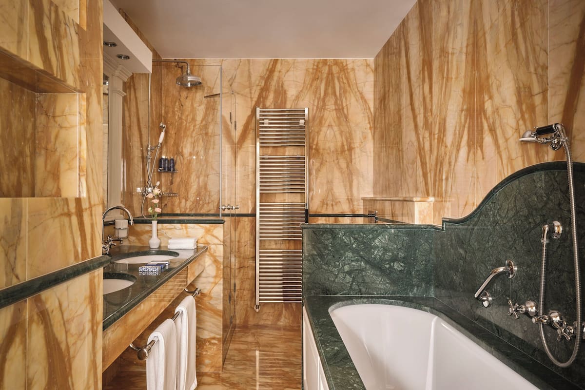 junior suite, lake view (deluxe) | bathroom | rainfall showerhead, towels