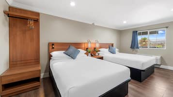 Pillow-top beds, desk, blackout curtains, free cots/infant beds