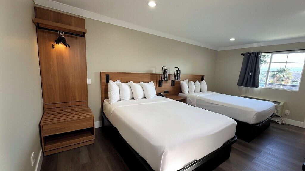 Pillow-top beds, desk, blackout curtains, free cots/infant beds