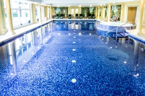 Indoor pool, open 7:00 AM to 7:00 PM, pool loungers