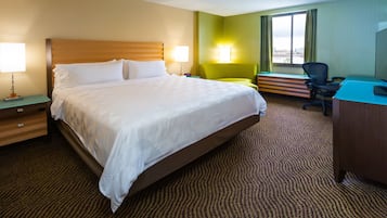 Hypo-allergenic bedding, desk, laptop workspace, blackout drapes