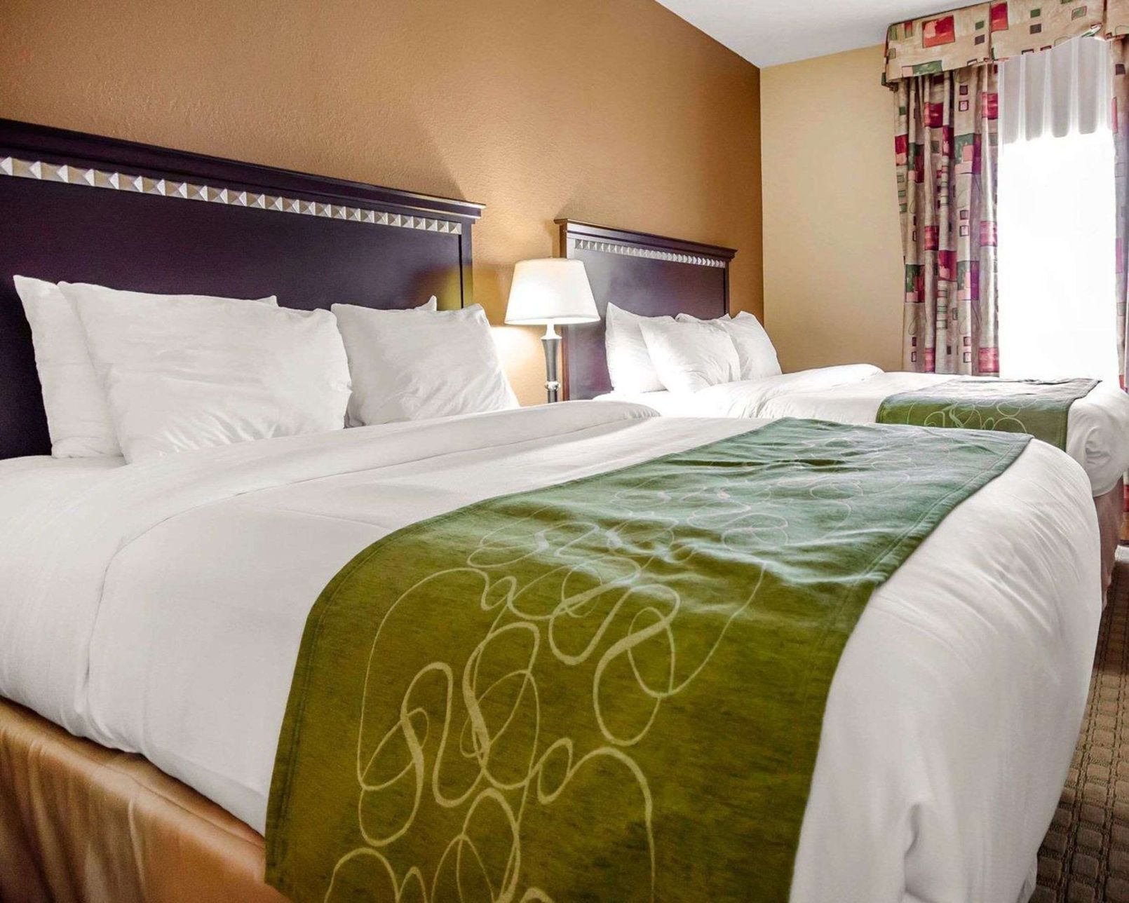 Premium bedding, desk, laptop workspace, iron/ironing board