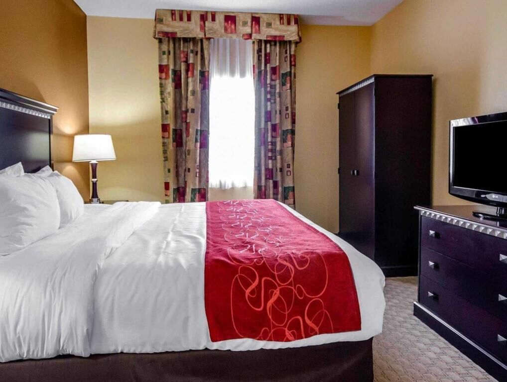 Premium bedding, desk, laptop workspace, iron/ironing board