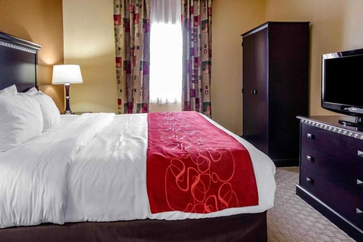 Premium bedding, desk, laptop workspace, iron/ironing board