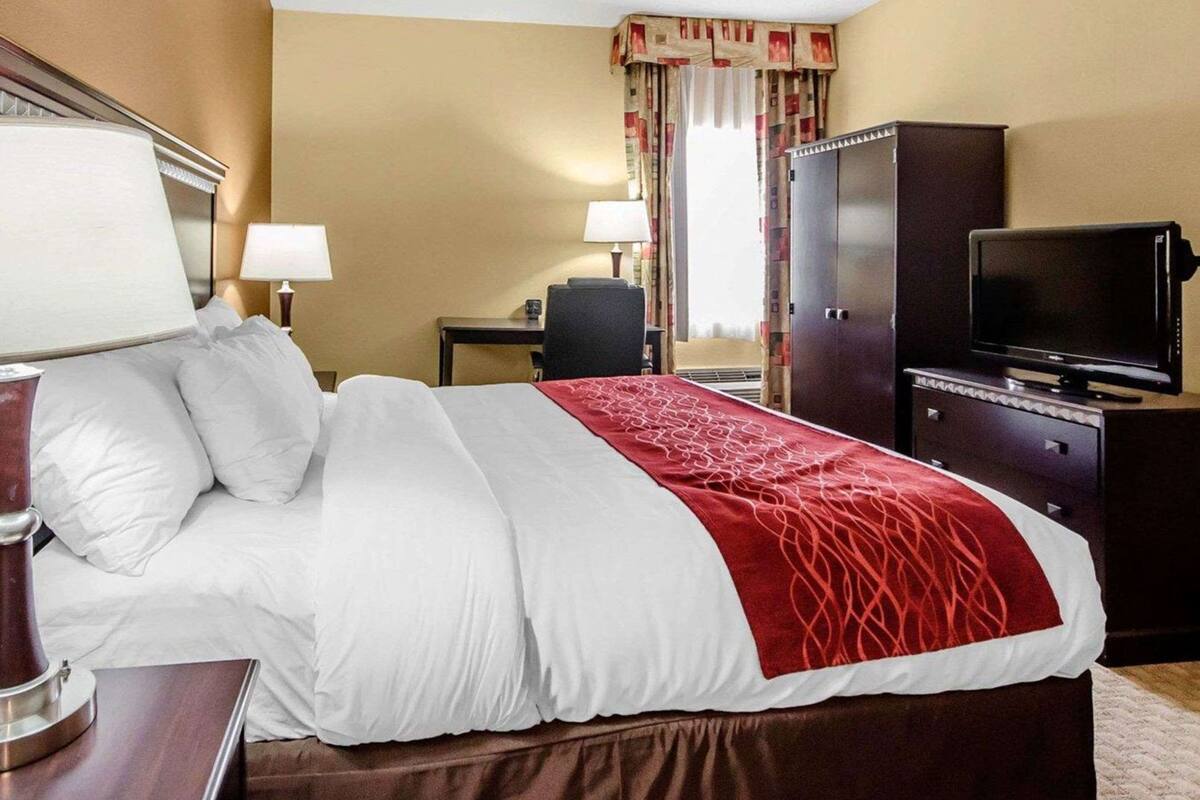 Premium bedding, desk, laptop workspace, iron/ironing board