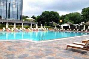 Indoor pool, seasonal outdoor pool, pool umbrellas, pool loungers