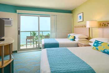 In-room safe, desk, laptop workspace, blackout drapes at Waikiki Circle Hotel By Castle