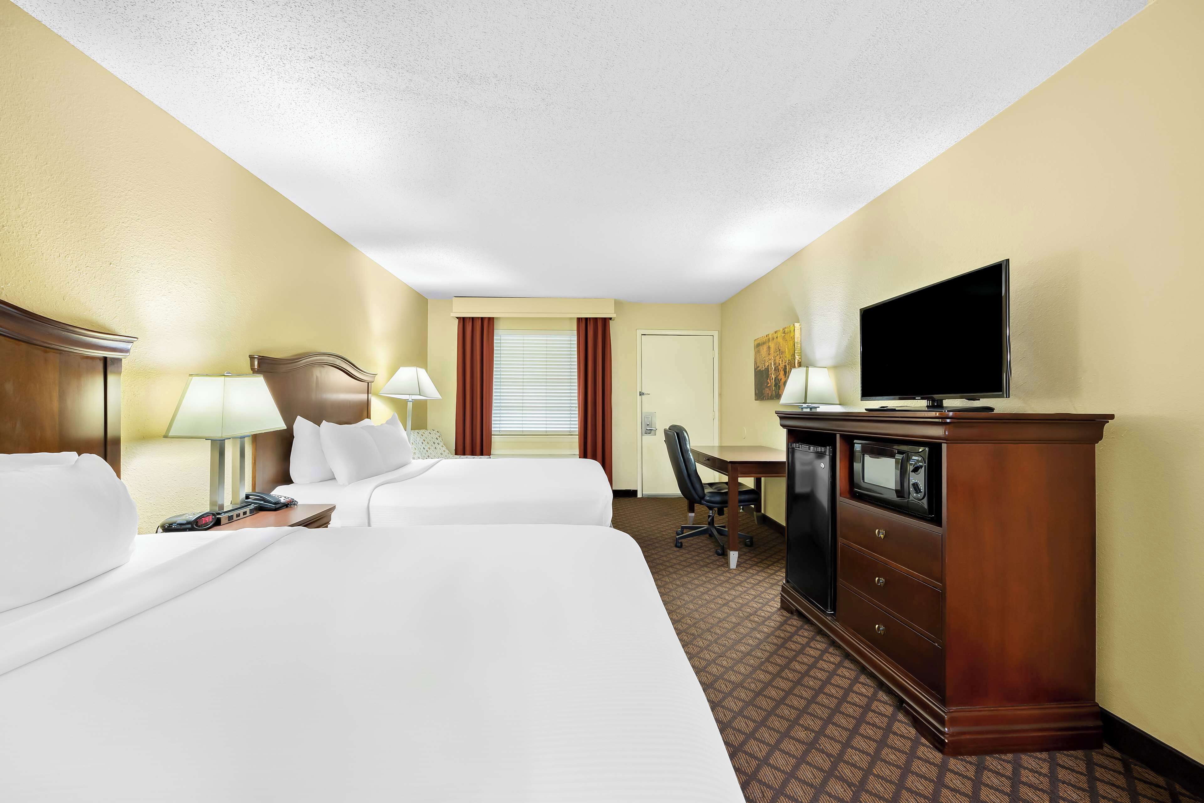 standard room, 2 queen beds, non smoking, refrigerator & microwave | premium bedding, pillow-top beds, individually furnished, desk