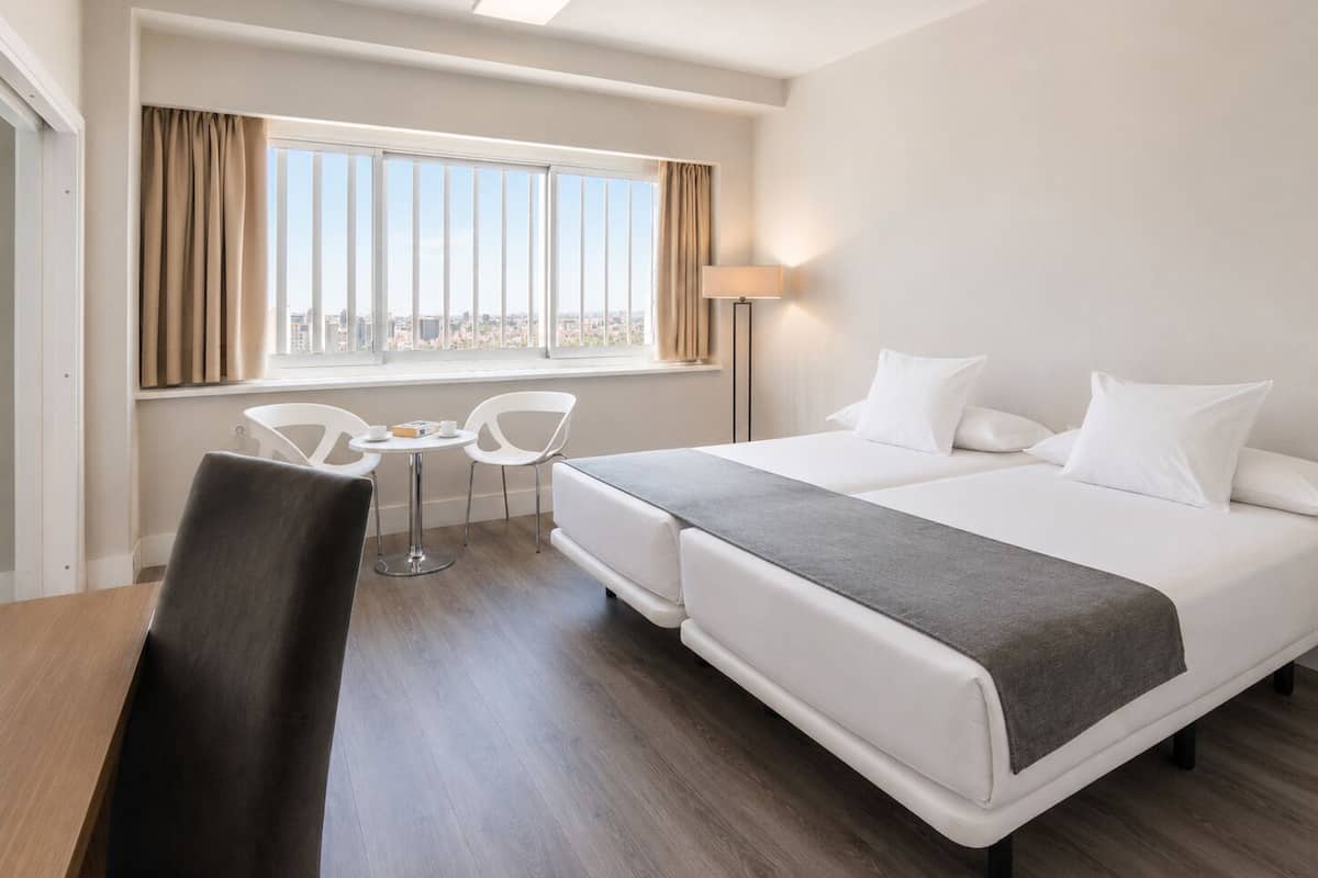 Family Room | Minibar, in-room safe, desk, blackout drapes