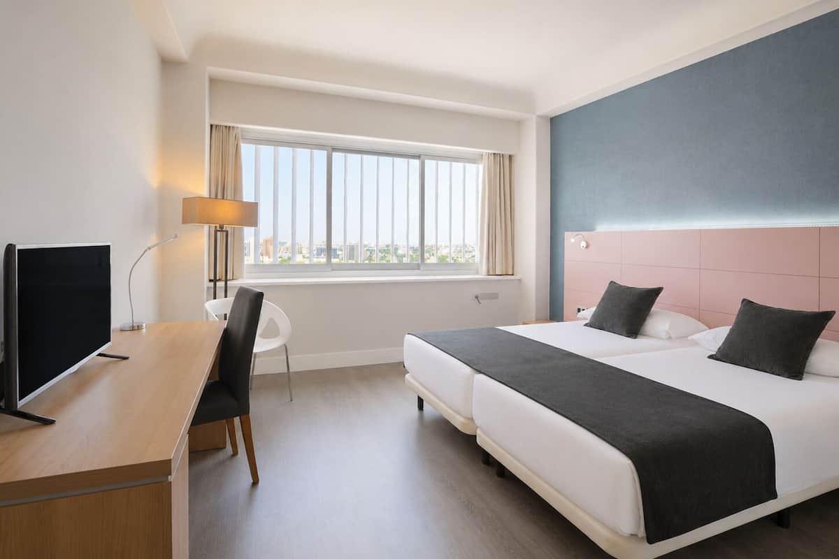 Double Room | Minibar, in-room safe, desk, blackout drapes
