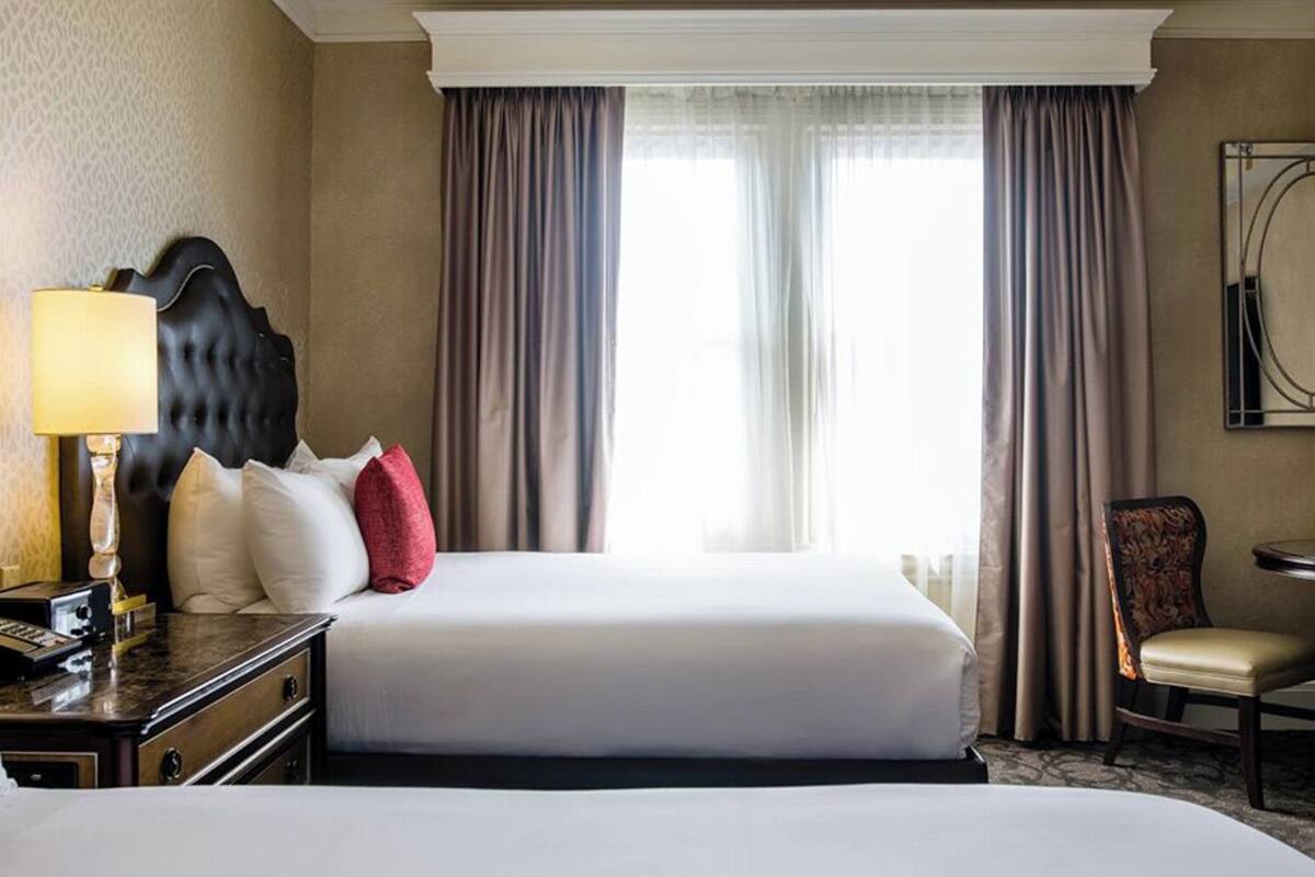 superior room, 2 queen beds | in-room safe, desk, laptop workspace, blackout curtains