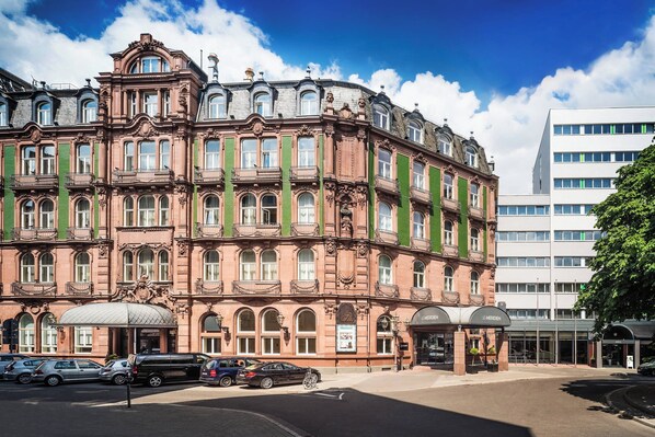 Stunning historic building with a classical facade and ornate detailing, blending seamlessly with modern architecture.