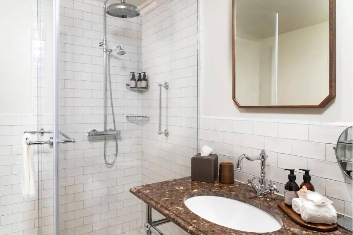 shower, rainfall showerhead, designer toiletries, hair dryer