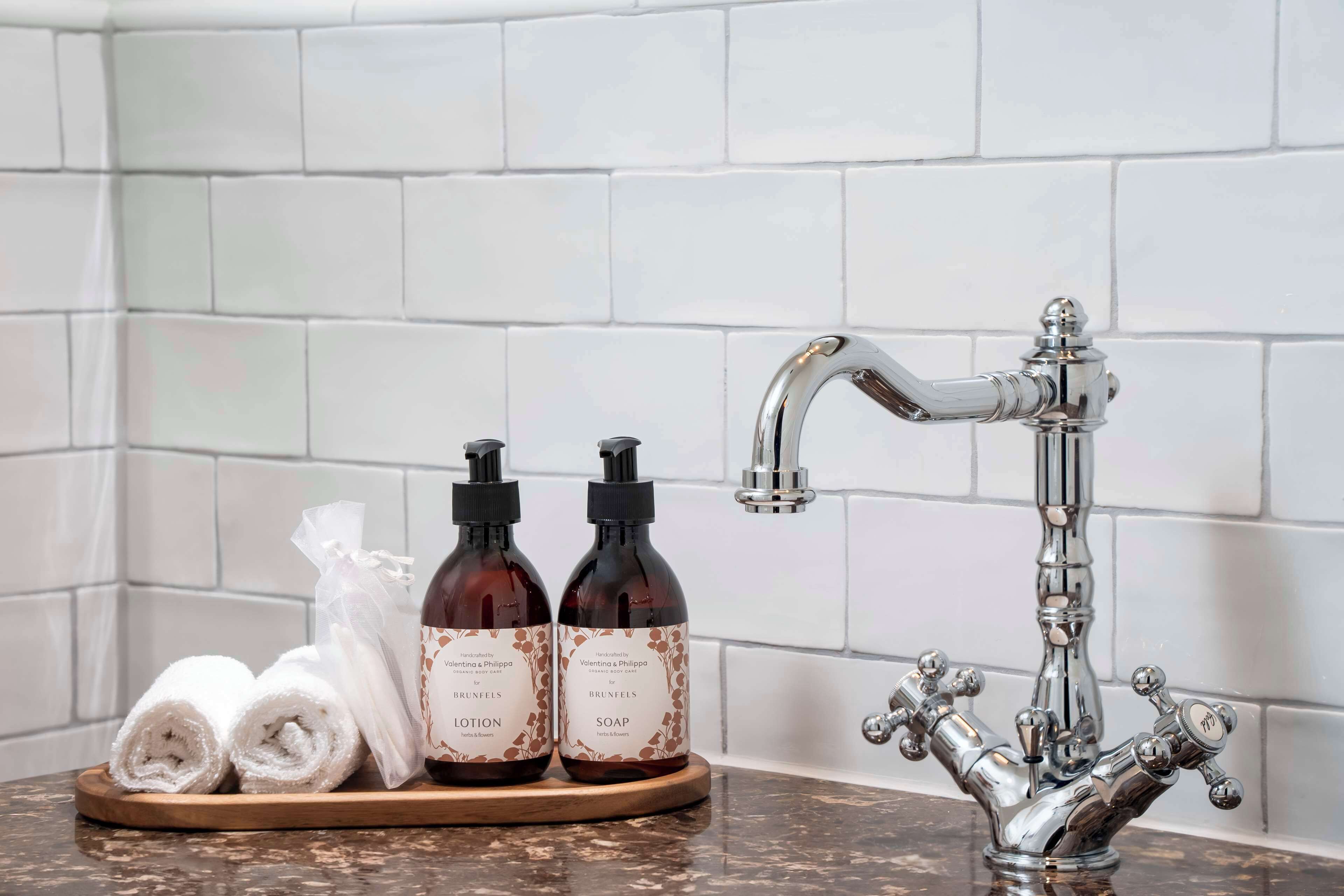 shower, rainfall showerhead, designer toiletries, hair dryer