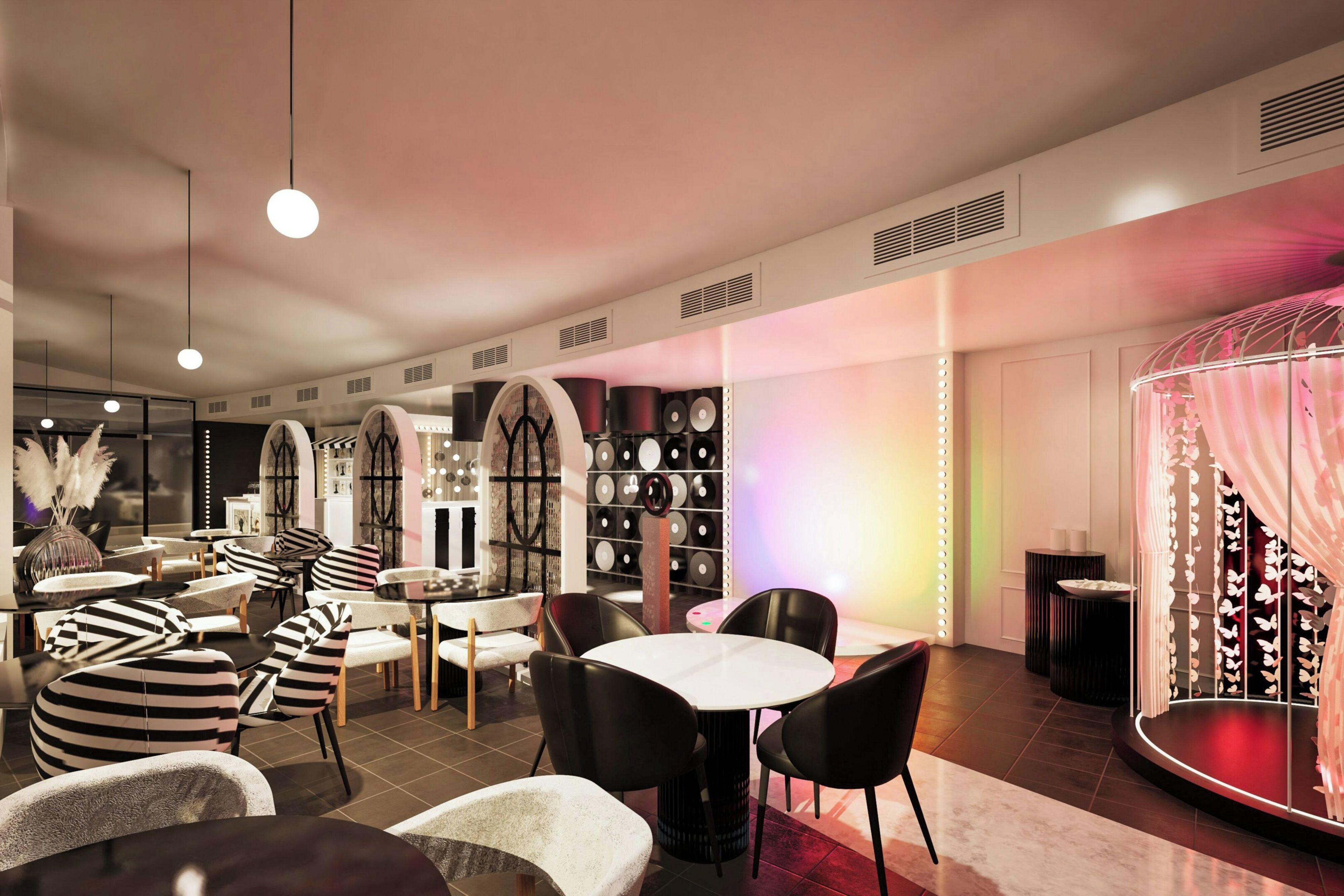 A modern interior with round tables, striped chairs, and a wall of vinyl records.