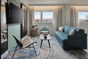 Executive Suite, 2 Bedrooms, City View | Living area | 55-inch flat-screen TV with cable channels, TV, books - Le Méridien Paris Arc De Triomphe (Paris)