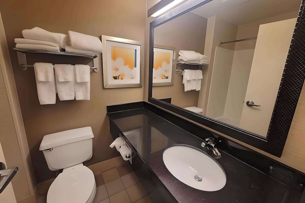 premium bedding, desk, blackout curtains, iron/ironing board