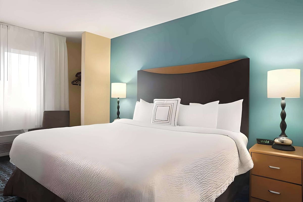 premium bedding, desk, blackout curtains, iron/ironing board